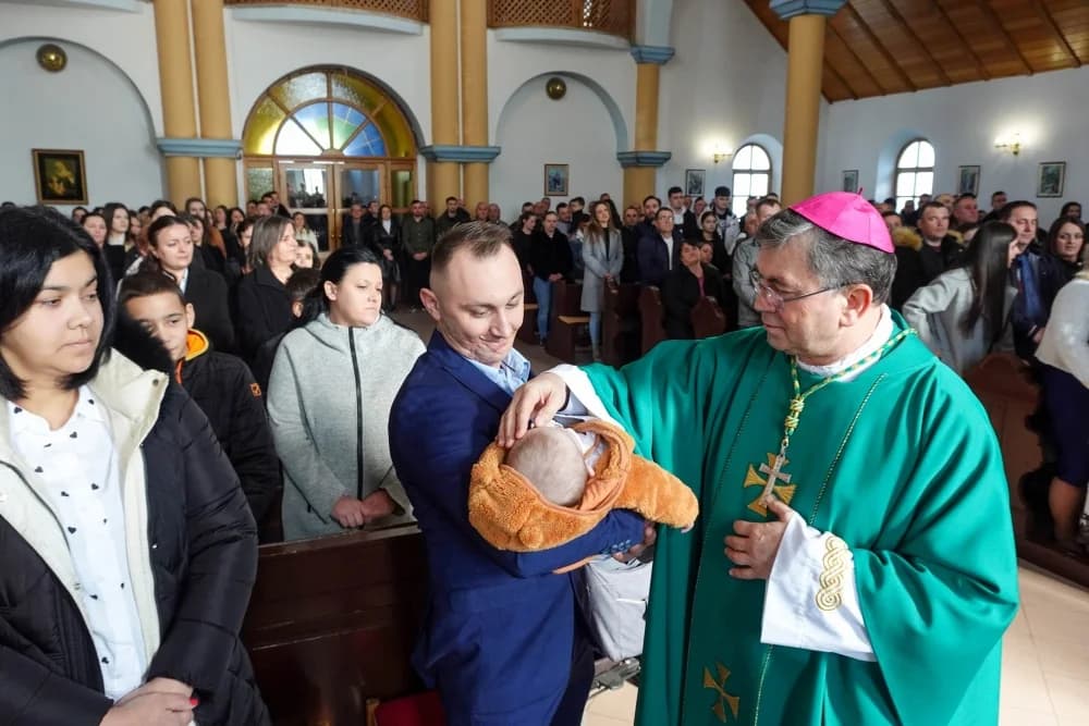 Krštenje šestog djeteta roditelja Jozić u Đulovcu
